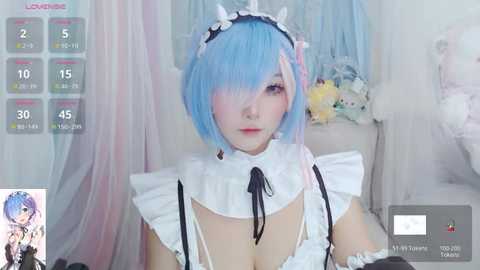 Media: Video of an anime-inspired maid character with light blue hair, white frilly outfit, and black ribbons, set against a soft pastel background.