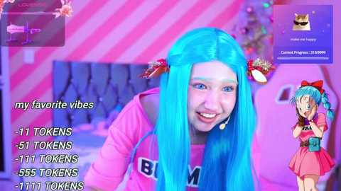 Media: Video of a woman with long, vibrant blue hair styled in pigtails with red bows, smiling in a pink sweater. Background features pink and white striped walls, a Christmas tree, and a chat window. Text overlays list 11 tokens, 555 tokens, and 1111 tokens.