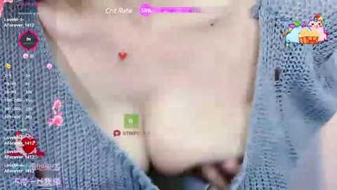 Media: Video of a fair-skinned woman in a blue knitted cardigan, revealing her ample cleavage. The background is blurred, with chat windows displaying names like \"Chill\" and \"Lily.\