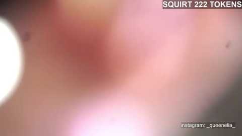 Media: A close-up, blurry video of a human ear with a bright, pinkish-red, inflamed area, likely a rash or infection. The image is titled \"SQUIRT 222 TOOKENS\" and includes a watermark with the Instagram handle @queenelizabeth.