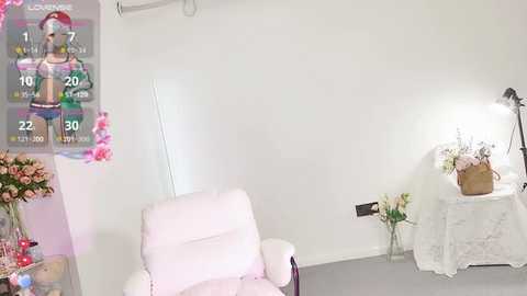 Media: A video of a minimalist, bright room featuring a pink armchair, a small white table with flowers, and a wall-mounted TV showing a fitness model. The room has a soft, pastel color palette.