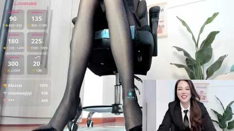 Media: Video of a woman in black sheer pantyhose seated in an office chair, with a digital display showing weight, BMI, and health statistics. Inset: Another woman in a black blazer, smiling, in a similar office setting.