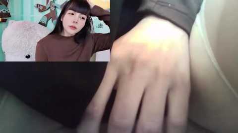 Media: Video collage: top-left shows an Asian woman with fair skin, straight black hair, wearing a brown sweater, smiling in a room with pastel walls and a plush toy; bottom-right features a close-up of a hand touching a white body part.