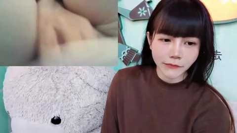 Media: Video collage featuring a young Asian woman with straight, dark hair in a brown sweater, next to a close-up of her bare back and a fluffy white teddy bear.