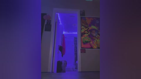 Media: A video of a dimly lit hallway with a vivid, colorful fish tank on the right, blue LED lights, and a red towel hanging on the left.