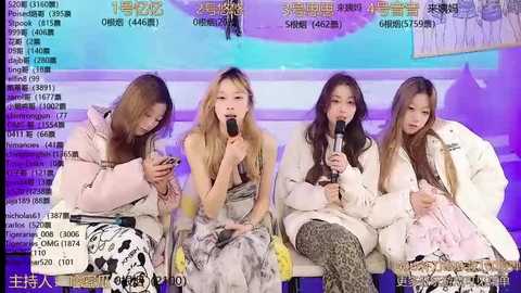 Media: Video of four Asian women seated on a stage, each holding microphones, wearing casual, stylish outfits. Background features a colorful, abstract backdrop with Chinese text.