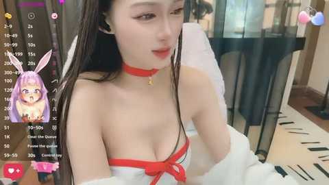 Media: Video of an East Asian woman with long, straight, dark hair, wearing a red choker and white lingerie, in a dimly lit room.