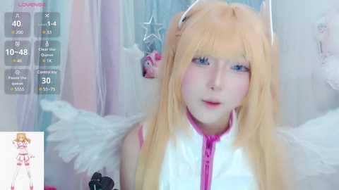 Media: Video of a young woman with fair skin, long blonde hair, and blue eyes, wearing a pink and white anime-style outfit with angel wings, set in a pastel-colored, star-themed room.