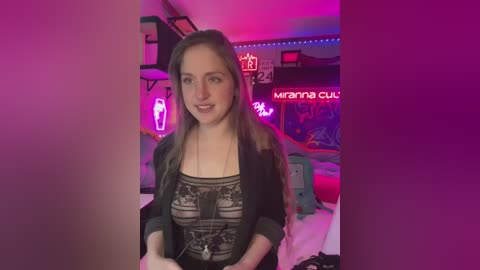 Media: A video of a young woman with fair skin and long brown hair, wearing a black lace top, standing in a neon-lit, colorful bedroom with a \"mama\" sign on the wall.