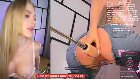 Media: Video of a blonde woman with large breasts wearing a lace bra, being penetrated with a metal rod, in a modern room with a black-and-white backdrop.