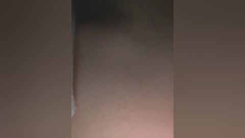 Media: A blurred, close-up video of a person's lower torso and thighs, with a visible tear in their skin, likely from a wound or injury. The background is dark and indistinct.