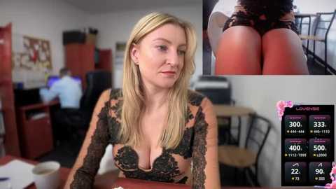 Media: Video of a blonde woman in black lace lingerie sitting at a desk in an office, with a close-up of her buttocks in another frame.