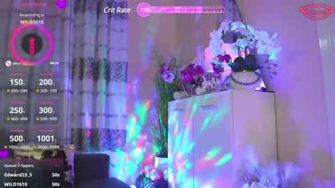 Media: Video of a bedroom with a vibrant, colorful, glowing effect. A white dresser holds a floral arrangement, surrounded by purple and blue lights. The background features a window with white curtains.