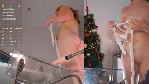 Media: Video of a nude woman with light skin, small breasts, and medium build, standing near a decorated Christmas tree, tying a white ribbon around her neck.