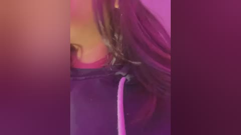 Media: A video of a close-up, blurred face with long, dark hair. The background features a gradient of pink and purple hues, creating a dreamy, ethereal atmosphere. The image is soft and out-of-focus.