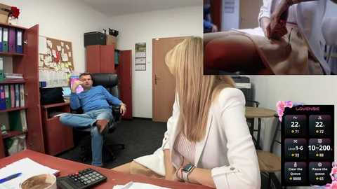 Media: A video of a white woman in a white jacket and blonde hair sitting at a desk in an office, while a man reclines in a chair, with a close-up of a foot massage in the upper right corner.