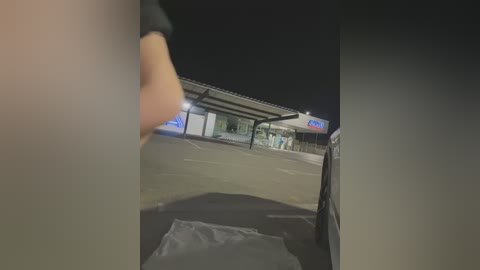 Media: A nighttime video shows a dimly lit convenience store with a partially visible person in the foreground. Snow covers the ground, and a car is parked outside.