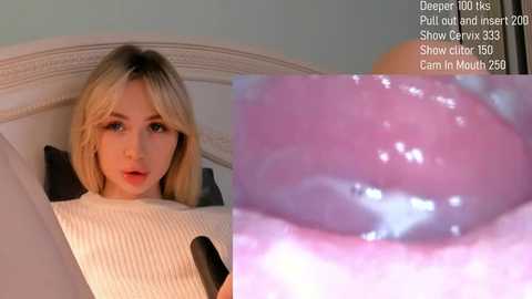 Video of a young, blonde woman in a white sweater, with a close-up of a pink, glossy tongue.