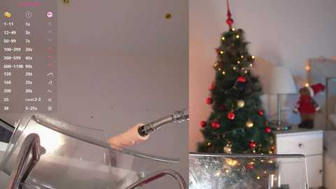 Media: Video of a festive indoor scene: a person spraying a transparent shower curtain with a hose, a decorated Christmas tree in the background.