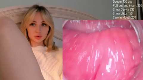 Media: A video of a blonde woman in a white sweater, lying on a bed with a pink, moist vaginal shot overlay.