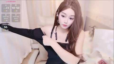 Media: Video of a young Asian woman with long brown hair, fair skin, and slender build, wearing a black dress, sitting on a bathtub floor in a bathroom, with a digital live stream overlay showing her viewers' comments.