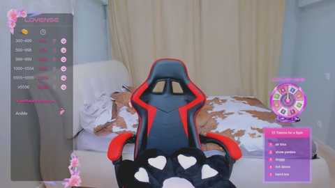 Video of a gaming setup featuring a red and black gaming chair, a bed with white and brown bedding, and a purple \"Fortnite\" timer screen.