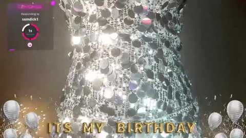 Media: Video of a woman's torso covered in soap bubbles with \"IT'S MY BIRTHDAY\" text in gold letters at the bottom, surrounded by white balloons.