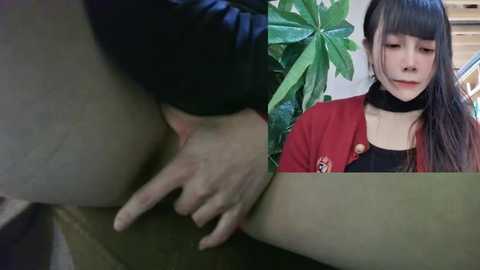 Media: Video: Close-up of a person's hand touching a person's genitals. Another image shows a young woman with straight black hair and a red cardigan, looking contemplative.