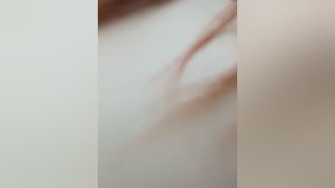 Media: A blurry video of a nude, light-skinned woman with undefined body parts and no discernible features. The image is abstract, with soft, ethereal colors and no distinct objects or background.