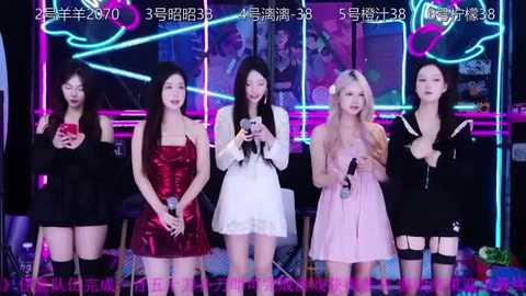 Media: Video of five Asian women, each in a different outfit, singing on a neon-lit stage. They hold microphones, with vibrant colors and diverse styles.