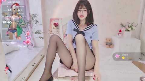 Media: Video of an East Asian woman with fair skin, black hair, and a petite frame, wearing a schoolgirl outfit, sitting seductively on a bench in a room with floral decor.