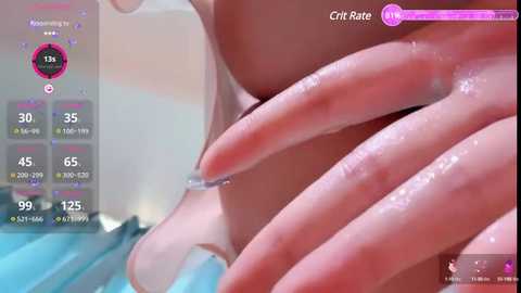 Media: A close-up video of a hand with manicured nails, wet with droplets, against a blurred background. A purple, digital overlay shows \"Crit Rate\" stats.