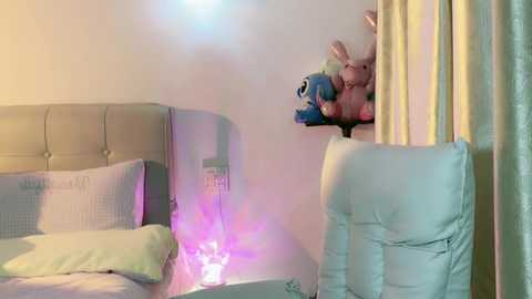 Media: A video of a child's bedroom with a plush toy horse and a glowing nightlight, soft pastel colors, and a neatly made bed with white sheets.