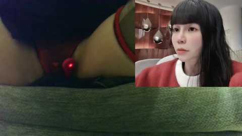 Media: Video of a woman in a red jacket and white shirt, with a green plant in the foreground, and a close-up of a woman's red lips.