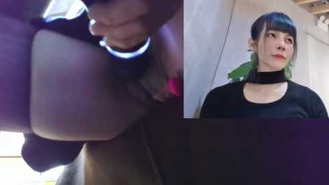 Media: A split image: left, blurred close-up of a person's hand holding a black object; right, a woman with dyed green hair, wearing a black choker and top, indoors.