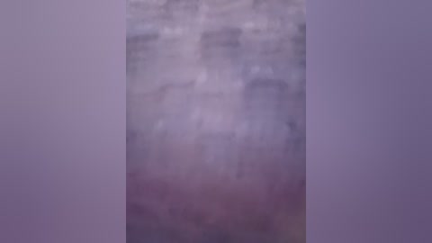 Media: A blurred, abstract video with a soft, gradient color palette of muted purples, pinks, and whites, creating a dreamy, ethereal effect. The image lacks distinct shapes or identifiable objects, emphasizing a sense of depth and movement.