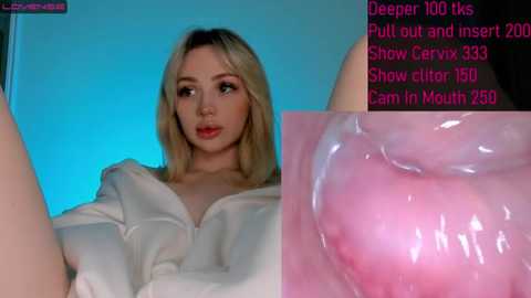 Media: A video of a blonde woman in a white robe, with a close-up of a pink, shiny, and glossy object in the background.