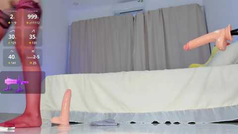 Media: A video shows a woman wearing red lingerie, standing in a bedroom with beige curtains, holding a realistic, large pink dildo. A purple vibrator is on the floor.