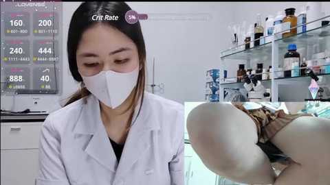 Media: Video of an Asian woman in a white lab coat and mask examining a woman lying on a medical table in a bright, sterile lab.