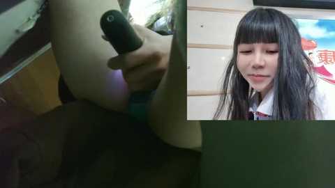 Media: Video: A close-up of a woman's hand holding a vibrator against her thigh, contrasting with a video of a Japanese woman in a white shirt with bangs.