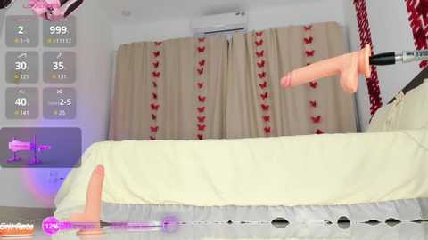 Media: Video of a VR scene showing a woman with pale skin and light brown hair, lying on a bed with a pink dildo inserted. Red curtains with butterfly patterns are in the background.