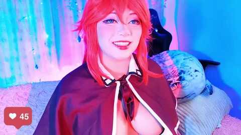 Media: Video of a cosplay character with vibrant red hair, wearing a revealing black cape, and large red lips. Background features a blue and pink gradient, plush toys, and a bed.