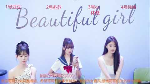 Media: A video of three Asian women in a studio, wearing traditional Japanese schoolgirl uniforms. They are seated in front of a light blue backdrop with \"Beautiful girl\" written in Chinese characters.