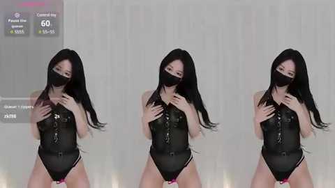 Media: A video of three Asian women in black leather corsets, face masks, and long black hair, standing in a row against a white background.