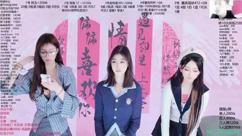 Media: Video of three young Asian women in different school uniforms, standing against a pink backdrop with Chinese text. They are engaged in various activities, highlighting their outfits and expressions.