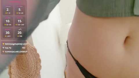 Media: A close-up video of a person's lower abdomen, showing a black thong, with a chart overlay indicating health metrics like heart rate and blood pressure.