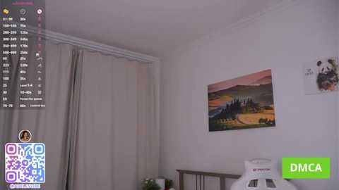 A video of a modern bedroom with beige walls, a large window covered by beige curtains, and a vibrant landscape painting on the right wall. The bed is partially visible, with a white headboard.