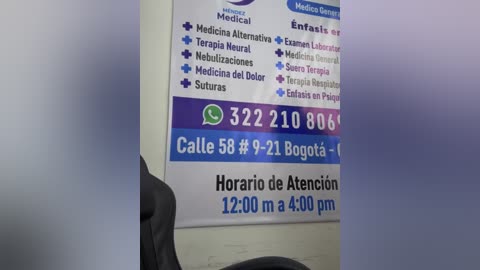 Video of a medical office sign in Spanish, listing services like medical assistance, emergency room, and urgent care, with a WhatsApp contact number.