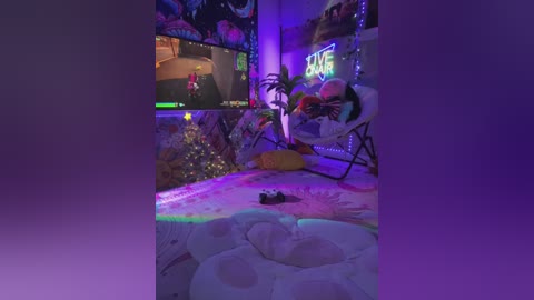 A video of a cozy, dimly lit living room with a video game controller on a white bean bag chair. The room is decorated with a lit Christmas tree, a neon \"GAME\" sign, and colorful LED lights.