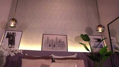 Video of a cozy bedroom with a purple headboard, patterned wallpaper, framed cityscape art, potted plants, and hanging spherical pendant lights.
